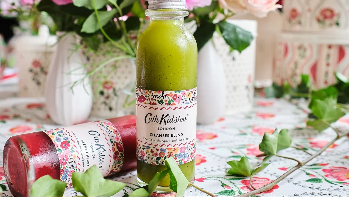A bottle of green smoothie with a Cath Kidston branded label